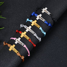 Adjustable cord and clasp detail on cross bracelet