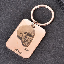 Rose Gold personalized football helmet keychain with engraved name and jersey number.