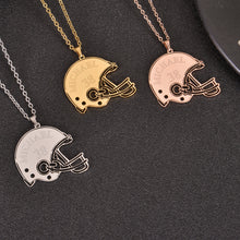 Personalized football helmet necklace displayed on a black jewelry background showing custom name and number details.