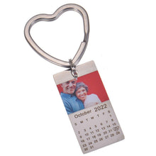 Close-up of engraved calendar month and year on keychain
