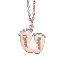 Rose Gold baby feet necklace personalized with a baby's name as a meaningful keepsake.