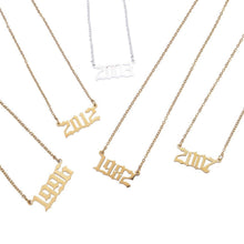 Personalized birth year necklaces displayed together as custom number jewelry for birthdays, anniversaries, and milestones.