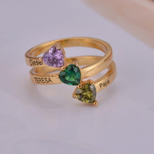 Close-up of three heart-shaped birthstones on ring band