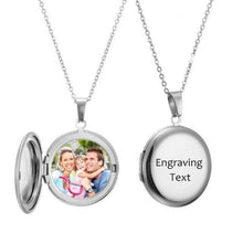 Silver custom folding round locket featuring engraved text on exterior cover and photo inside.