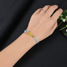 Woman wearing personalized adjustable cross bracelet