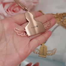 Custom picture pendant featuring detailed angel wing design