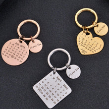Custom calendar keychain laid flat on dark background