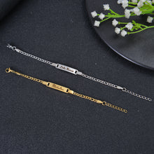 Image of Gold and Silver Bracelet Laid Flat on Black Background