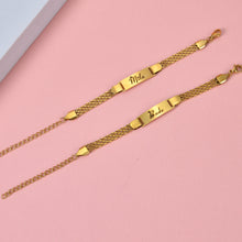 Close-up view of lobster claw clasp, end caps, and adjustable chain extender link on double strand bracelet.