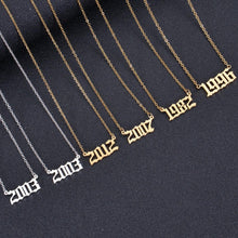 Gold, Silver, and Rose Gold personalized birth year necklaces displayed together.