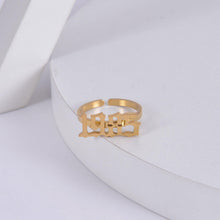 Gold personalized birth year ring featuring a custom year in bold Old English font.