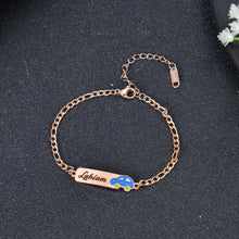 Close-up of Rose Gold lobster claw clasp and Figaro style chain links on personalized name bar bracelet.