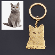 Custom engraved pet keychain showing a pet portrait with the pet name engraved below