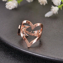 Rose gold custom heart name ring displaying elegant cursive lettering within large heart shape.