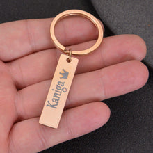 Close-up of engraved name and heart detail on bar keychain