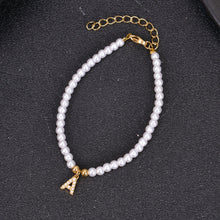 Gold pearl initial bracelet with letter A charm