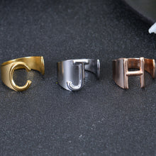 Close-up of bold letter detail on adjustable ring band