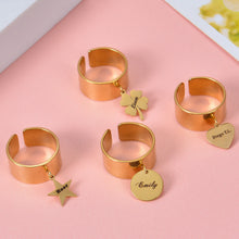 Pendantify personalized gold open cuff wide band rings featuring custom engraved dangling charms in star, clover, disc, and heart shapes.