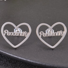Silver custom heart outline stud earrings featuring script name Pendantify across the center of the open frame.