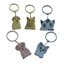 Pet portrait keychains shown in silver gold and rose gold with custom engraved pet designs