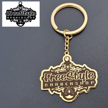 Custom business logo keychain with personalized company branding on a polished metal pendant