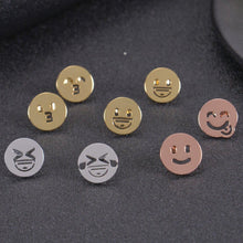 Gold, silver, and rose gold emoji earrings shown together
