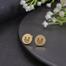 Close-up of cut-out emoji face detail on stud
