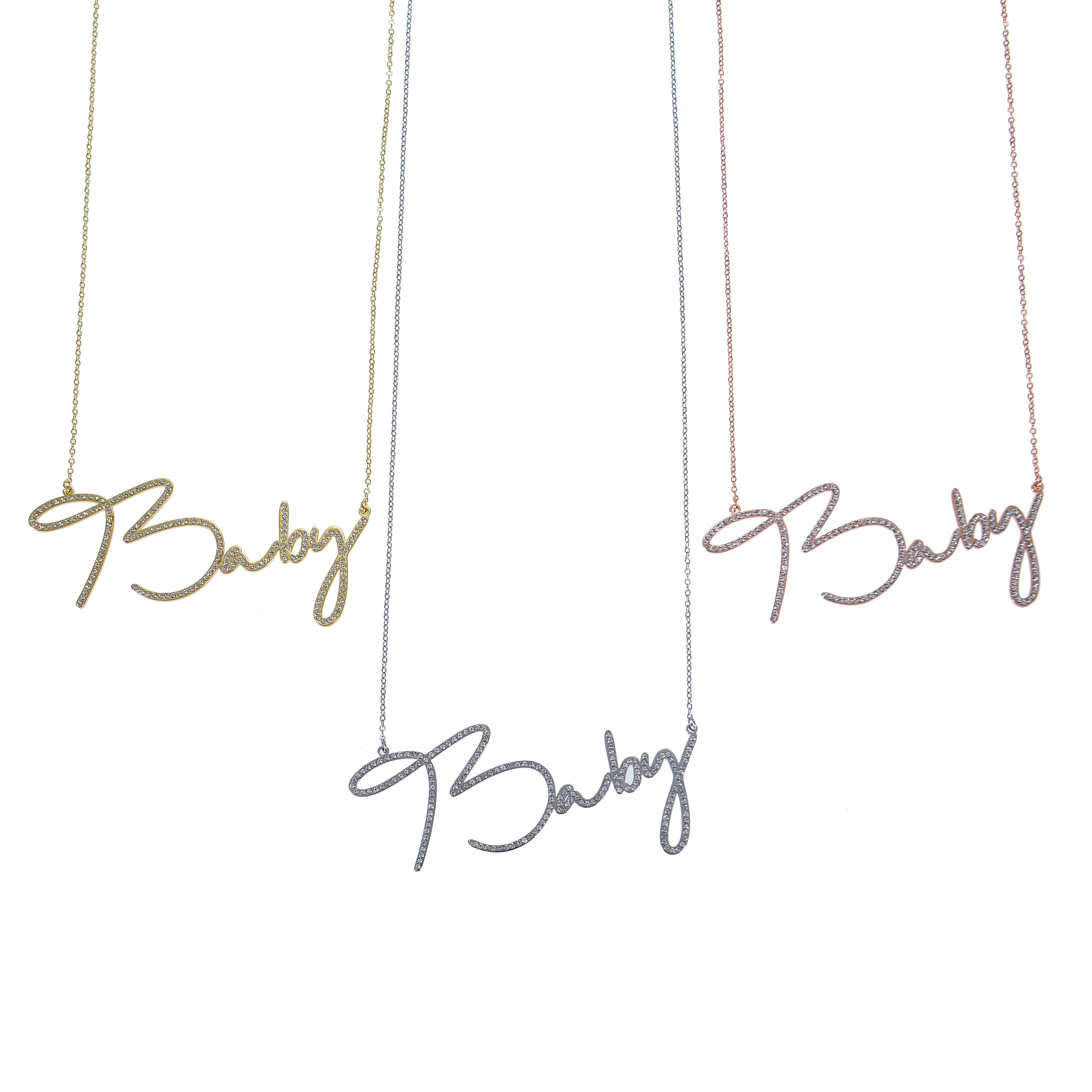 Gold, silver, and rose gold cursive necklaces shown together