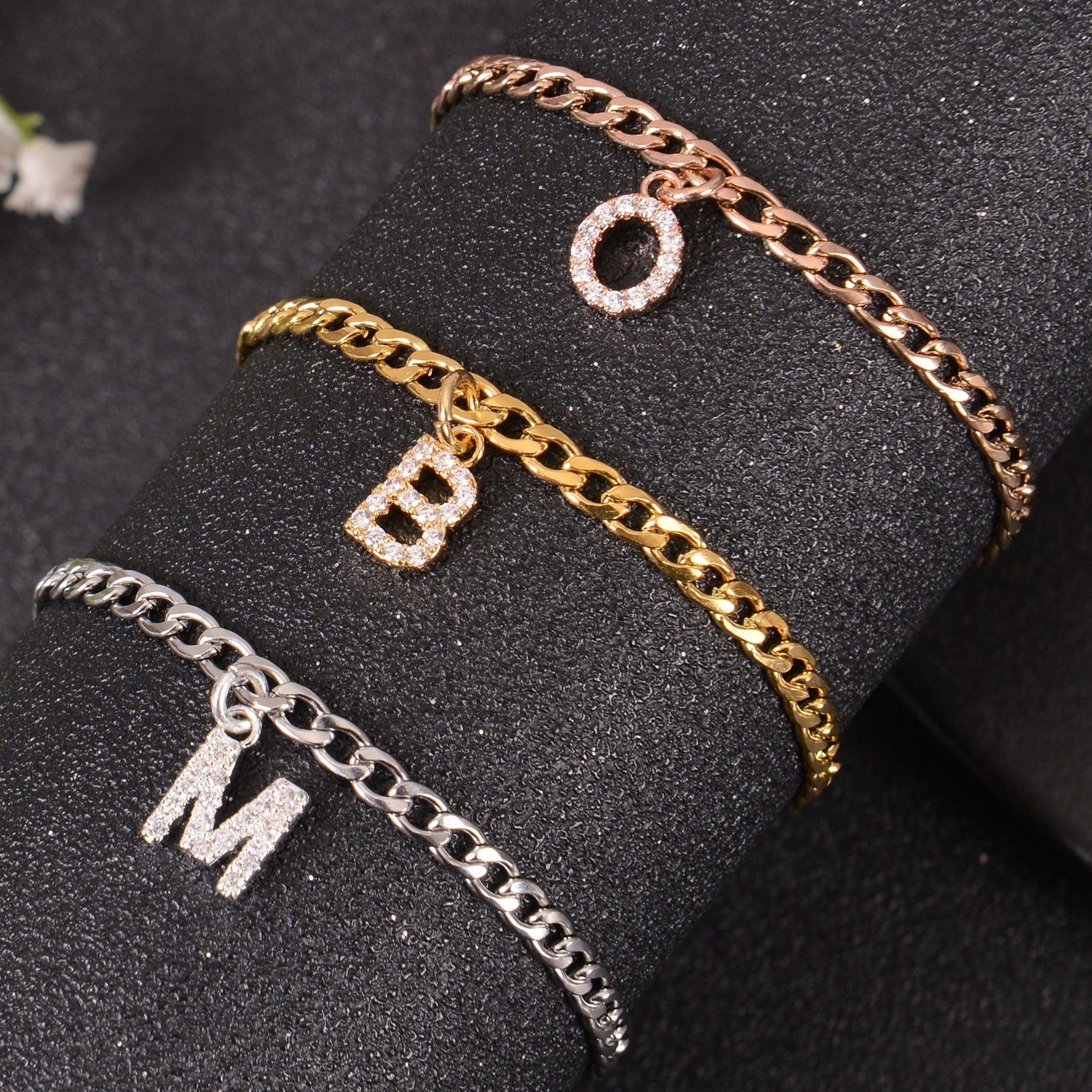Initial charm bracelets displaying different letters