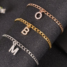 Initial charm bracelets displaying different letters
