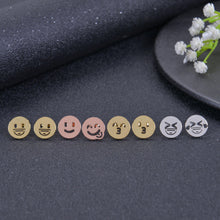 Multiple emoji stud earring designs laid out together