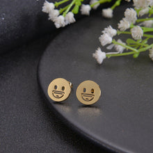 Gold emoji stud earrings with smiley face design
