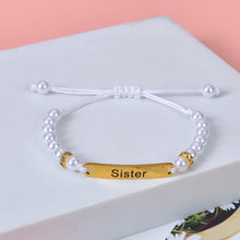 White pearl beaded adjustable bracelet with customized gold nameplate bar engraved with Sister.