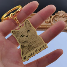 Person carrying a personalized engraved pet portrait keychain with custom pet name