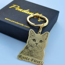 Custom engraved pet keychain showing a pet portrait with the pet name engraved below