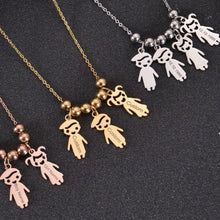 Family jewelry featuring personalized boy and girl figures