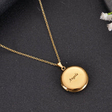 Closed gold circle locket pendant featuring custom engraved text message on polished front cover.