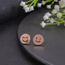 Rose gold emoji stud earrings with tongue-out design