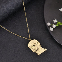 Gold meme face necklace featuring a selectable funny cartoon design