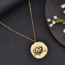 Gold meme face necklace featuring a selectable funny cartoon design