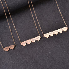 Pendantify personalized family heart necklace with custom engraved names across joined heart charms in rose gold, silver, and gold.