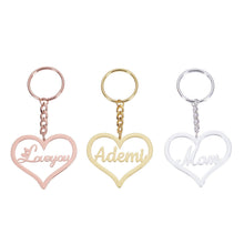 Pendantify personalized heart name keychain featuring cutout cursive script in rose gold, gold, and silver finishes.