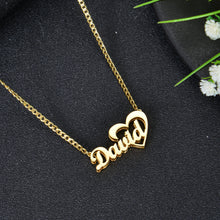 Gold custom name necklace with cursive script lettering David seamlessly integrated into an open heart outline pendant on a curb chain.