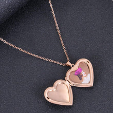 Rose gold custom folding heart locket featuring engraved text on exterior cover and photo inside.