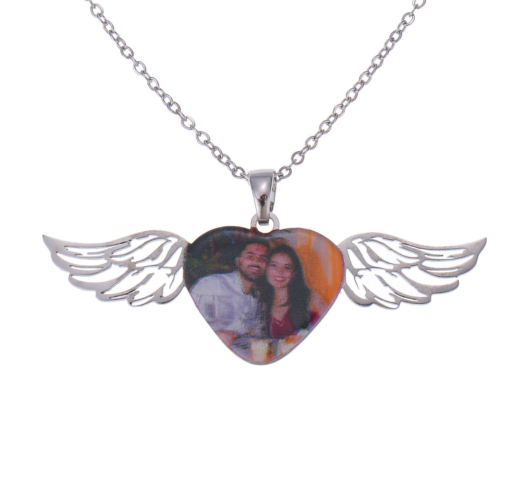 Silver angel wings photo necklace with personalized picture pendant displayed on a black background.