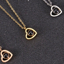 Gold silver and rose gold photo projection necklaces shown together