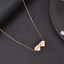 Rose gold personalized two-heart bar necklace with custom engraved names Emify and Alivia on fine cable chain.
