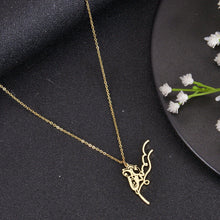 Gold meme face necklace featuring a selectable funny cartoon design