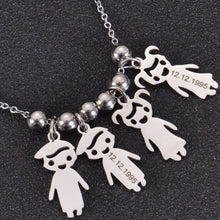Close-up of engraved children charms with custom names