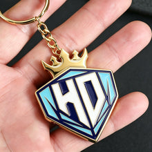 Person holding a colorful personalized photo keychain with custom picture